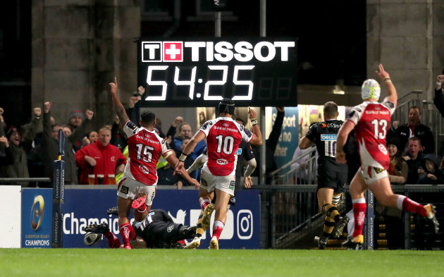 Ulster players celebrate as Jacob Stockdale scores a try