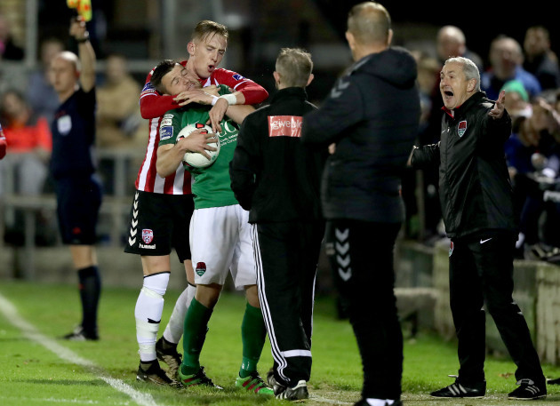 Steven Beattie with Ronan Curtis tussle on the sideline