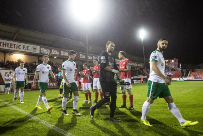 Greg Bolger leads his team out as St. Pat's players form a guard of honour