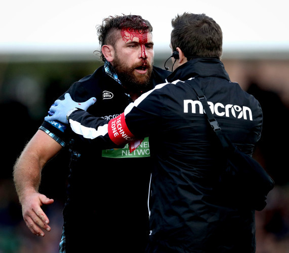 Callum Gibbins with a blood injury after a clash of heads
