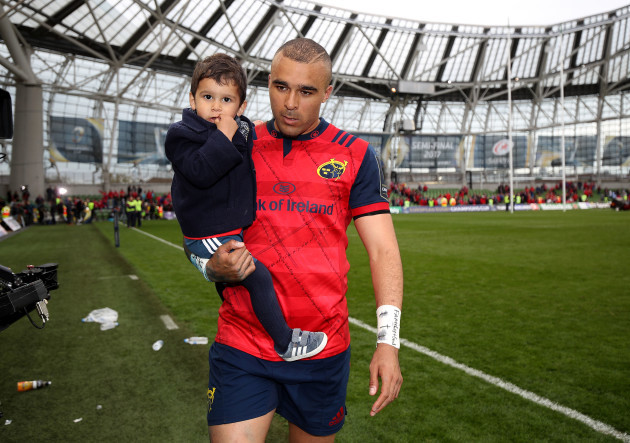 Simon Zebo leaves the field with his son Jacob