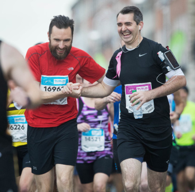 Runners share a joke during the Dublin Marathon