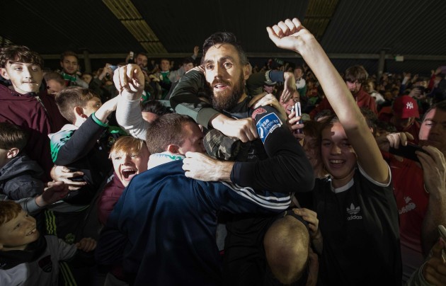 Mark McNulty jumps into the crowd at the shed end to celebrate