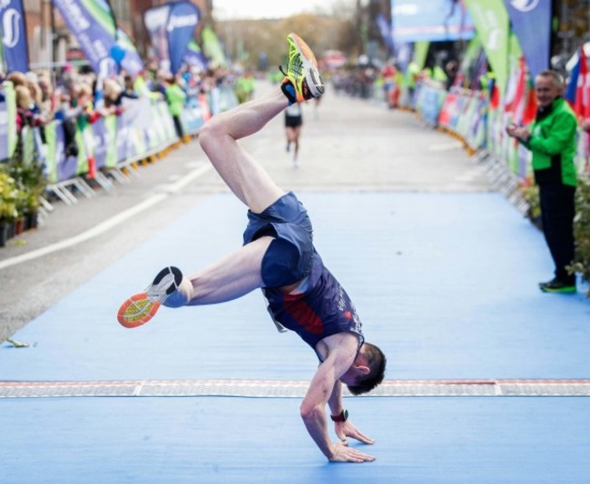 Killian Nolan cartwheels over the finish line