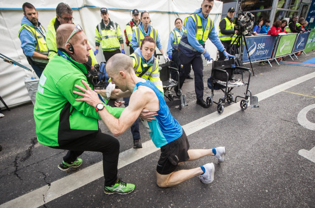Jeremy Curran falls to the floor after completing The SSE Airtricity Dublin Marathon