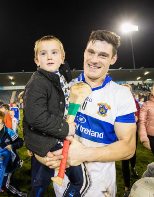 Diarmuid Connolly celebrates with team mascot Marcus Brady