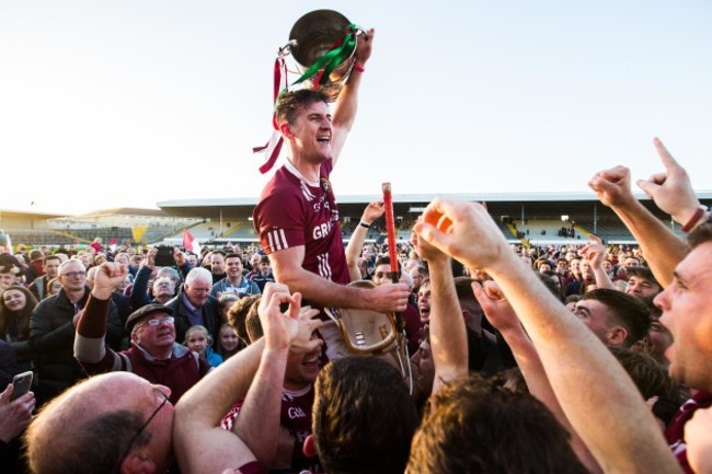 Ollie Walsh celebrates after the game with the trophy