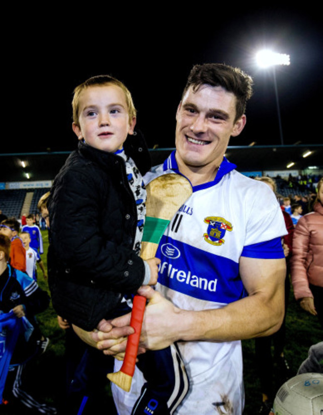 Diarmuid Connolly celebrates with team mascot Marcus Brady