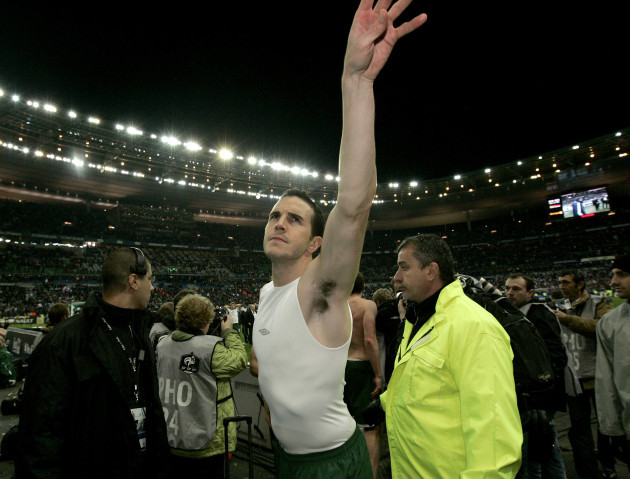 John O'Shea throws his jersey to the Irish fans after the game