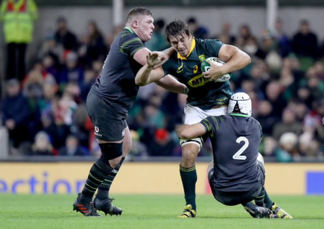Eben Etzebeth is tackled by Tadhg Furlong and Rory Best