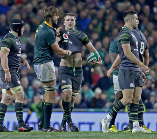 Lood de Jager pulls Iain Henderson's jersey