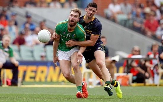 Aidan O’Shea with Scott Pendlebury