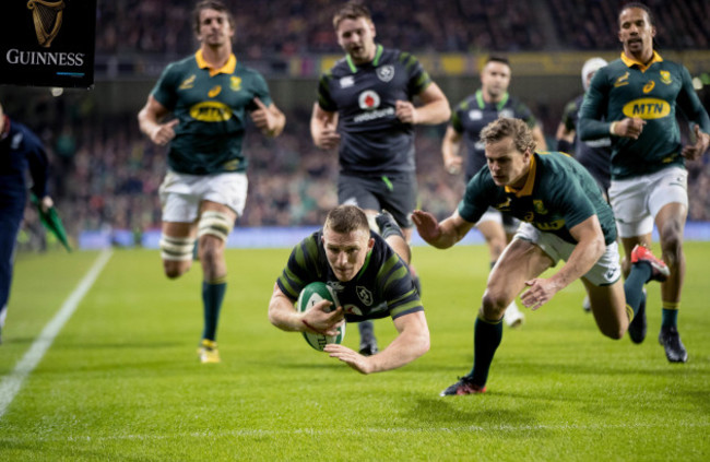 Andrew Conway scores a try despite Andries Coetzee