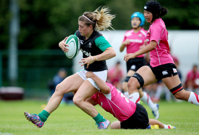 Ailsa Hughes scores a try despite Noriko Taniguchi