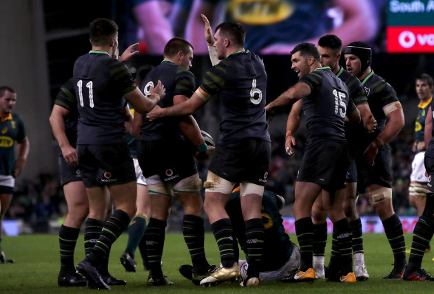 CJ Stander is congratulated by teammates after winning a turn over