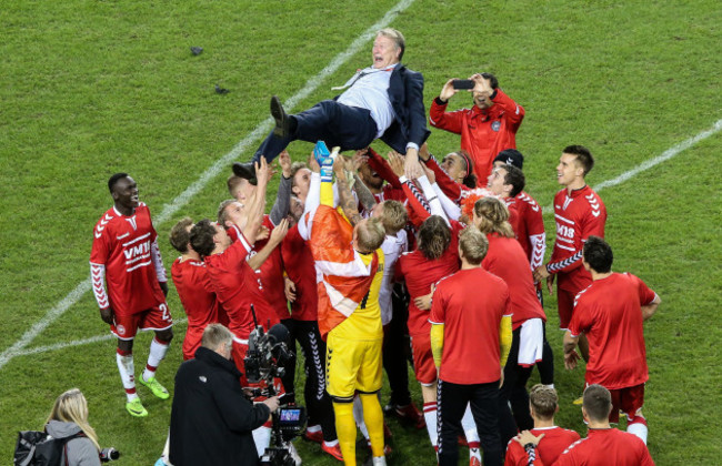 Denmark players celebrate with Aage Hareide