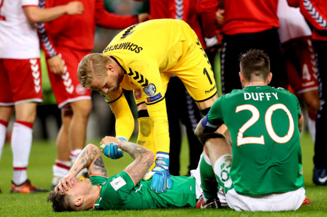 Kasper Schmeichel consoles Jeff Hendrick after the game