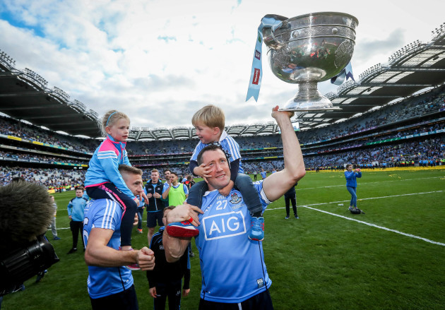 Denis Bastick celebrates with his son Aidan and The Sam Maguire