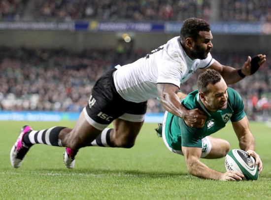 Dave Kearney scores a try despite the efforts of Timoci Nagusa