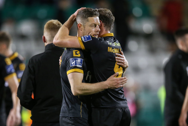 Shane Grimes and David McMillan celebrate after the game