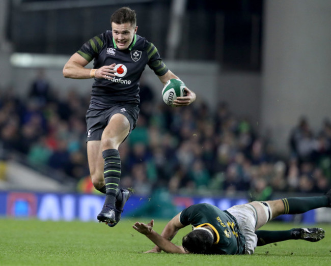 Jacob Stockdale makes a break past Francois Louw