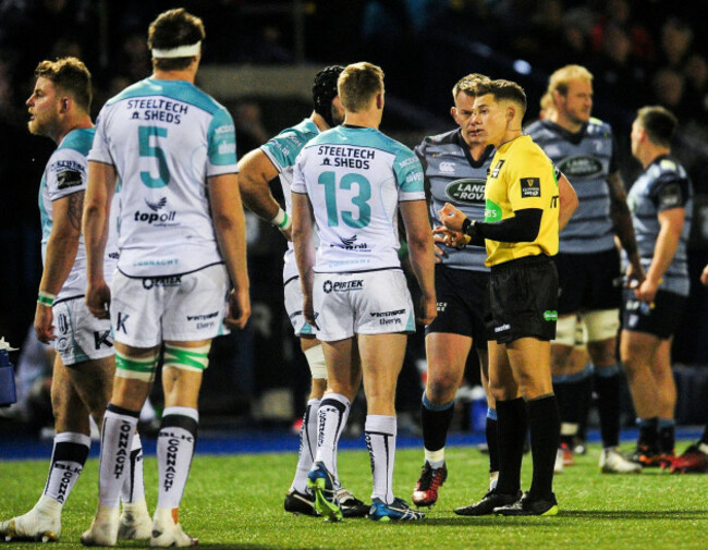 Eoin Griffin is shown a yellow card by referee Craig Evans