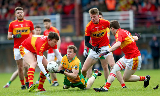 Barry Moran, Danny Kirby and Shane Hopkins tackle Gary Sice