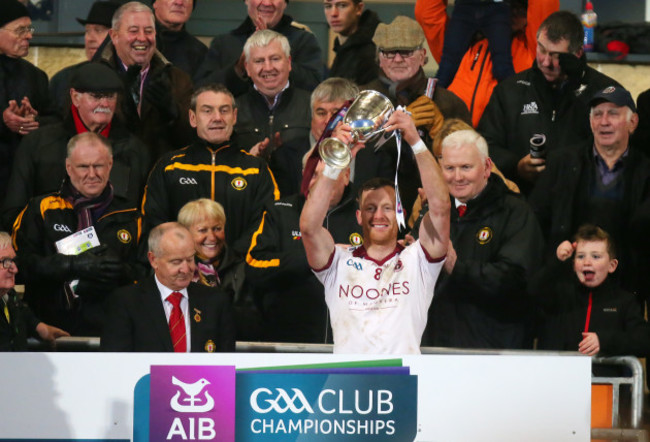 Patsy Bradley lifts the cup after they win the final