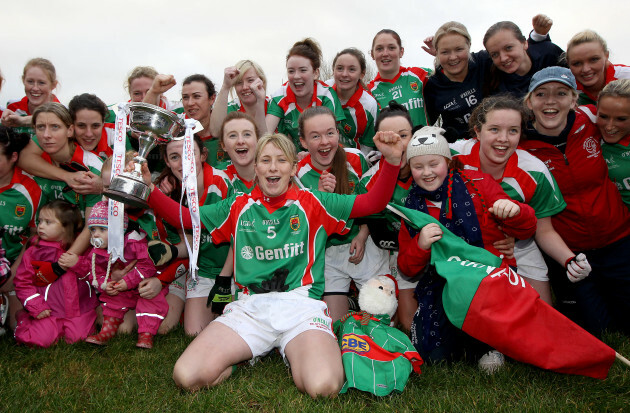 Marie Corbett celebrates with the trophy