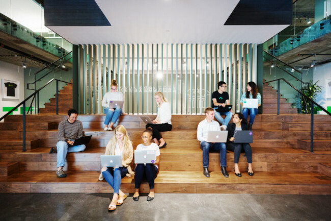 Team meeting on the steps of SurveyMonkey's San Mateo HQ