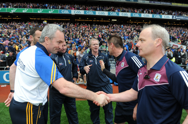 Michael Ryan shakes hands with Micheal Donoghue after the game