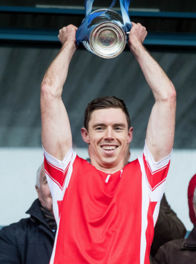 Paul Schutte lifts the trophy