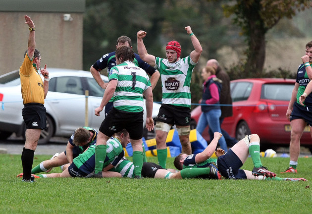 Naas players celebrate a try