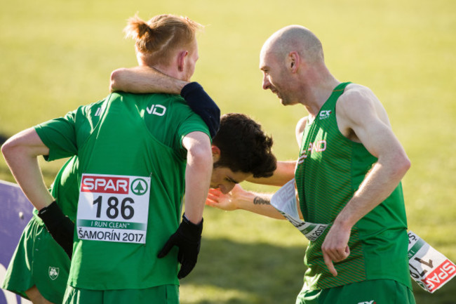 Sean Tobin, Hugh Armstrong and Kevin Maunsell celebrate after their team finished in fifth place