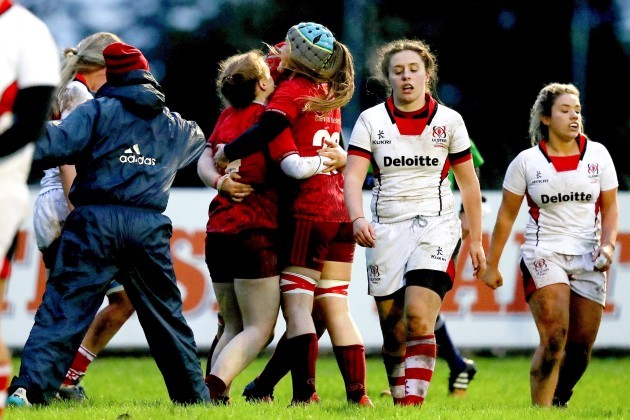 Laura Sheehan celebrates scoring a try with teammates