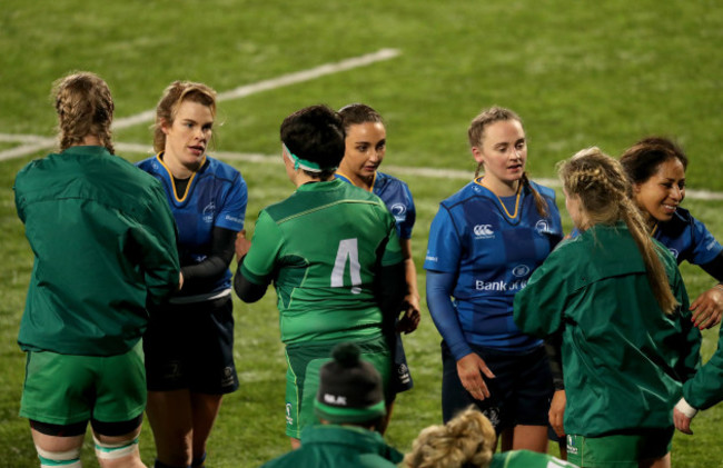 Both teams shake hands after the game