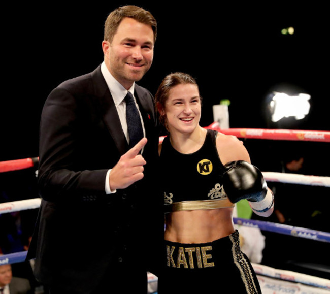 Katie Taylor celebrates her win with Eddie Hearn