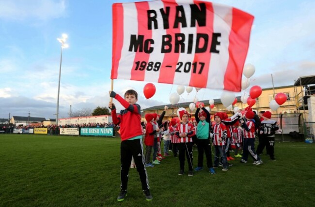 Members of the Derry City FC Cubs who released balloons in memory of club captain Ryan McBride prior to kick off