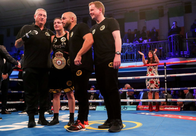 Katie Taylor celebrates after the fight as her mother Bridget cheers on