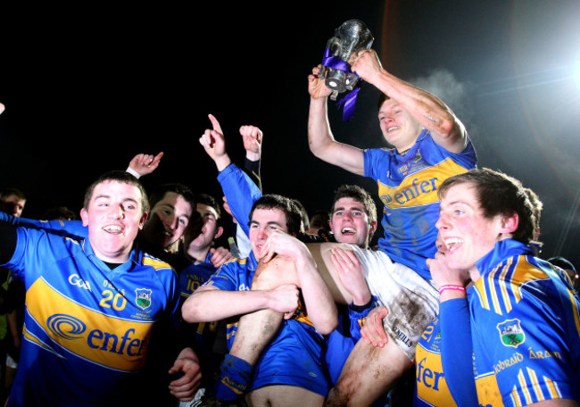 Players hold up captain Ciaran McDonald