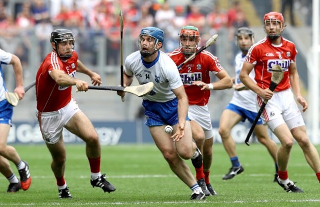 Michael Walsh of Waterford evades the Cork defence