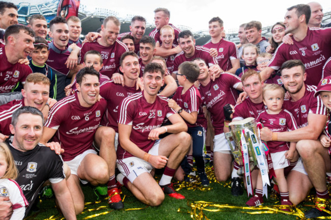 Galway players celebrate with the Liam MacCarthy cup