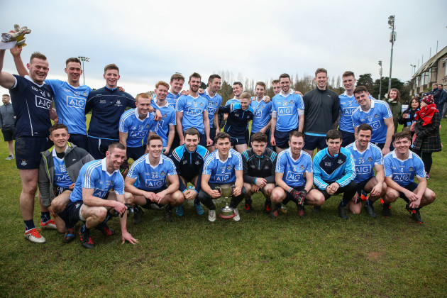 The Dublin team celebrate with the trophy after the game