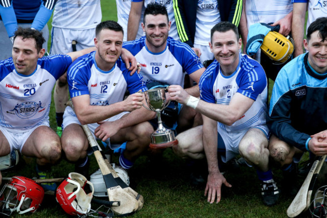 Alan Moore, Keith Connolly and Niall Corcoran celebrate with the trophy