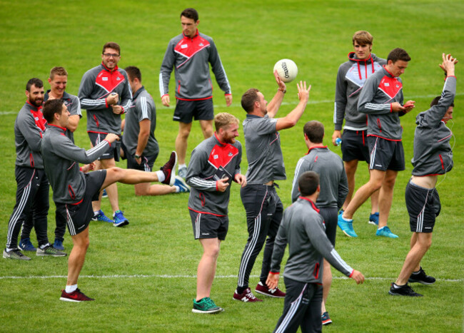 Cork players inspect the pitch
