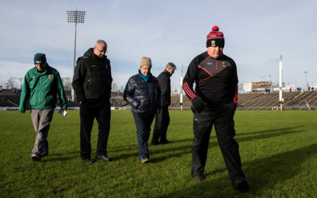 Stephen Rochford inspects the pitch