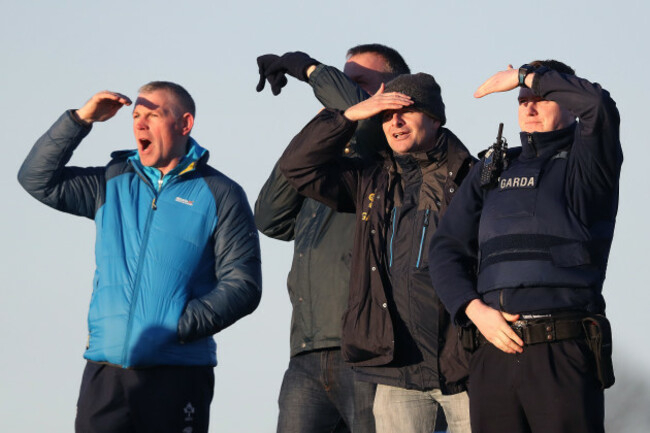 Supporters struggle to see the game in low lying sun