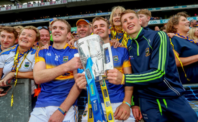 Noel McGrath, John McGrath and Brian McGrath celebrate