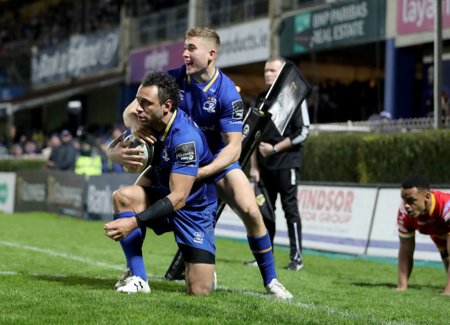Isa Nacewa is congratulated by Jordan Larmour after scoring his sides fifth try