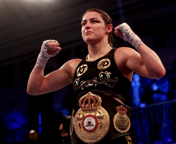Katie Taylor celebrates after beating Jessica McCaskill